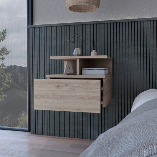 Grey floating bedside table on a wall next to a bed and a window