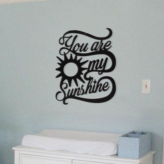 You are my sunshine wall art on a wall on top of a baby diaper changing bed