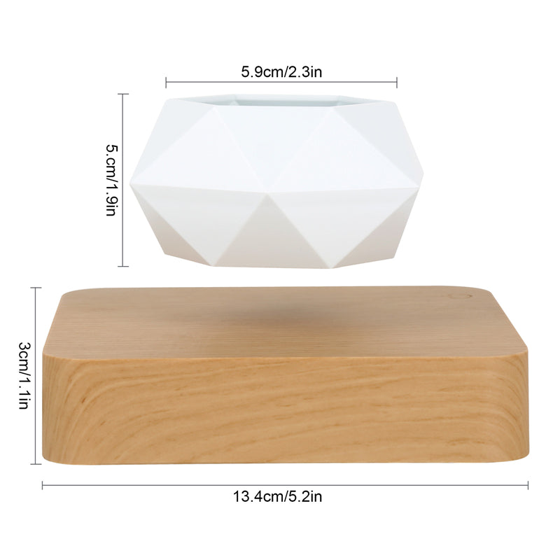 White Plant pot levitating on a wooden board