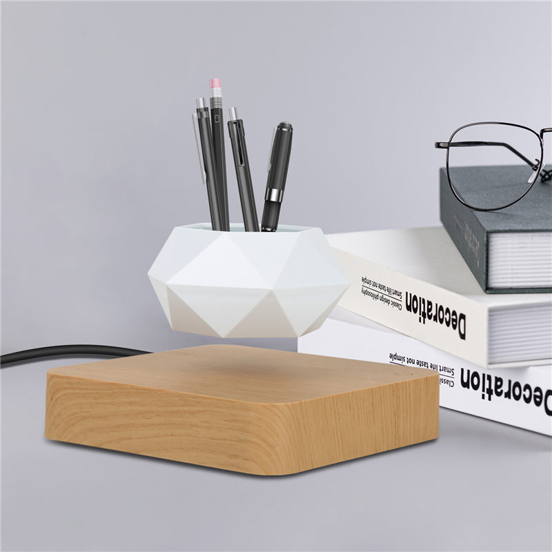 White Plant pot levitating on a wooden board